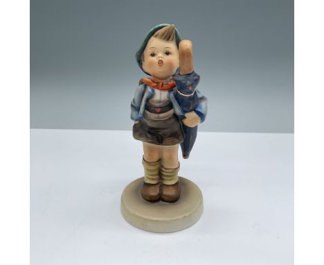A charming Hummel figurine titled "Home from Market," showcasing a young boy with an umbrella and a pig in a basket. This del
