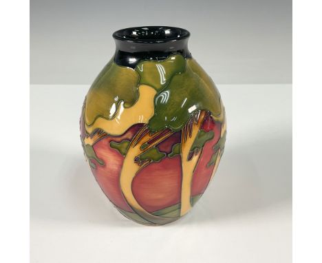 An exquisite Moorcroft vase designed by Emma Bossons. This striking piece captures the glowing beauty of a sunset sky with bo