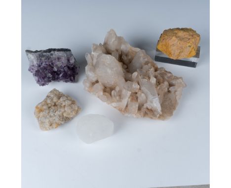 This captivating mineral rock grouping features a stunning array of natural specimens including Amethyst and Quartz alongside