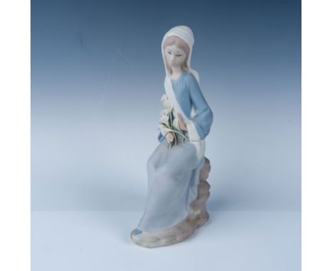 Lladro porcelain figurine titled "Girl with Lilies," model number 1014972, showcasing a serene young girl in a flowing gown h