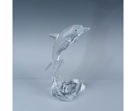 Elegant Swarovski crystal maxi figurine depicting a leaping dolphin on a stylized wave base, beautifully capturing the dynami