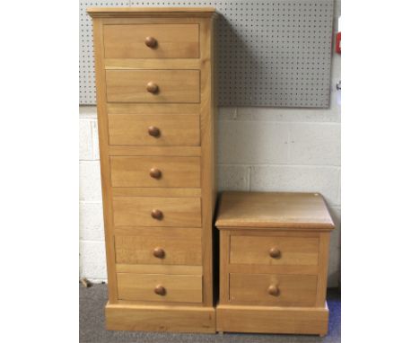 A contemporary light oak chest of drawers and a bedside cabinet. The chest with seven short drawers, the cabinet with two sho