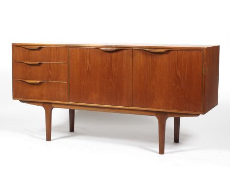 A 1960s AH Mcintosh teak sideboard. Bearing metallic maker's plaque to drawer, with two double doors enclosing a shelf and th