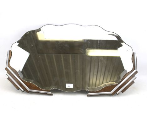 A bevelled edge Art Deco mirror. Mounted onto a shaped mahogany board with silver painted details, L73cm Condition Report: So