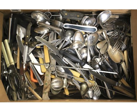 A large assortment of flatware. Including silver plated examples, some with wooden handles