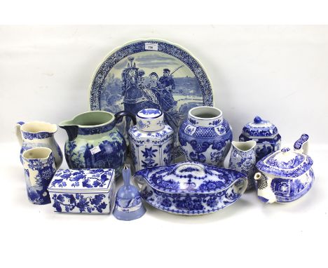 An assortment of blue and white ceramics. Including a Spode teapot, Delft plate, vases, etc