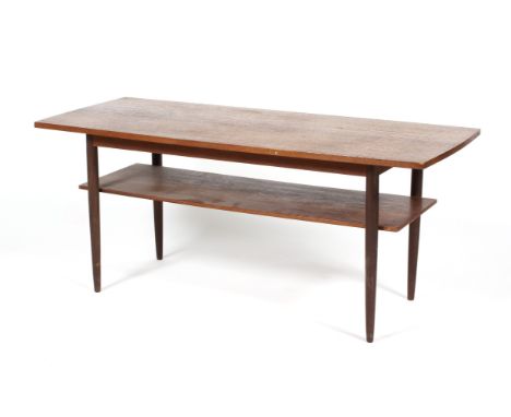 A mid-century teak rectangular coffee-table. With lower shelf, on four tapering cylindrical supports, L120cm x D49.5cm x H51c