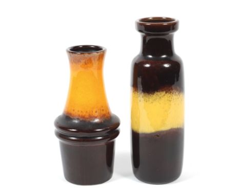 Two West German pottery vases. Circa 1960s, moulded marks, the first of cylindrical form glazed in brown and yellow, the othe