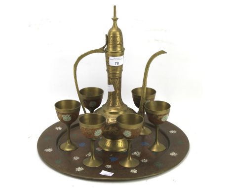 A Middle Eastern enamel and brass tray and a six cup and jug set. All with engraved details, jug H34cm