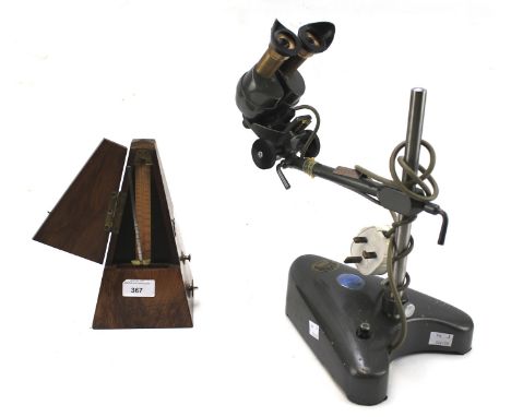 A De Maelzel Metronome and a C Baker microscope. The metronome in a rosewood case, H23.5cm, the microscope model CRL no 3593