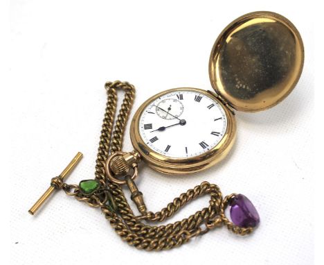 A gold plated full hunter pocket watch with Albert chain. The white enamel dial with Roman numerals