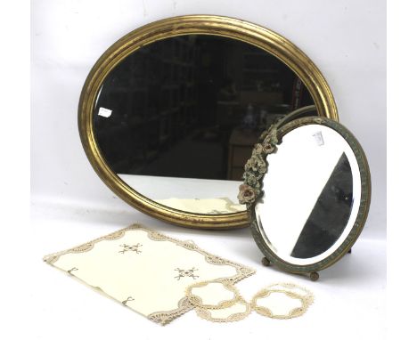 An oval gilt framed wall mirror and a barbola mantel mirror. The wall mirror measuring 47cm x 56cm