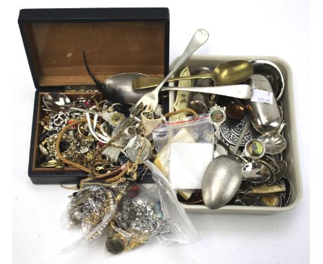 An assortment of costume jewellery and flatware. Including a silver plate snuffbox, rings, brooches, etc.