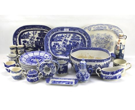 An assortment of blue and white ceramics. Including a set of Spode plates, a Staffordshire platter, Delft bottle etc