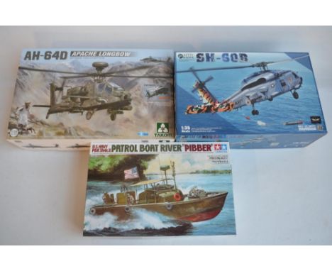 Three unstarted 1/35 scale model kits to include a Kitty Hawk Sikorsky SH-60B Sea Hawk, Takom AH-64D Longbow Apache (markings
