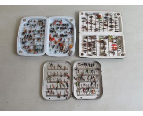 Three cases of hand-tied fly fishing lures of various styles and materials