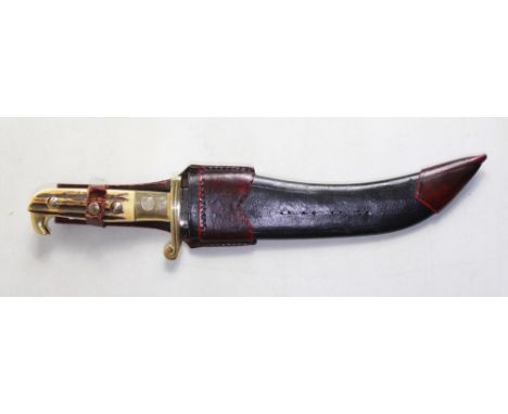 Ornate Bowie knife by Linder-Messer, Solingen. 8'' curved blade with Buffalo hunt etching. Brass handle with 1/2 cross guard 