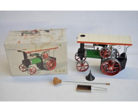 Boxed Mamod TE1A live steam Steam Tractor model in good previously used condition with accessories, box fair with water damag