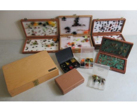 Assortment of hand-tied fly fishing flies of various styles in wooden and plastic cases. (2)