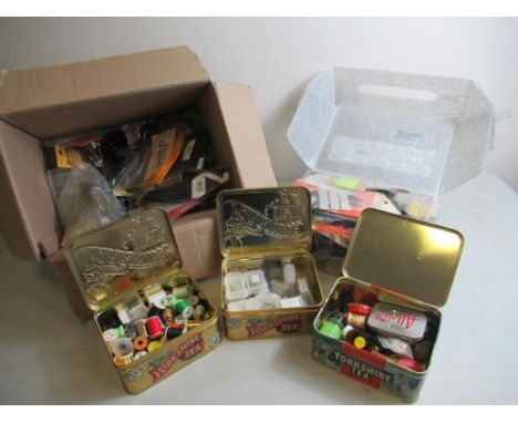 Large assortment of fly fishing fly-tying materials and equipment, including a vice, various types of feathers, different thr