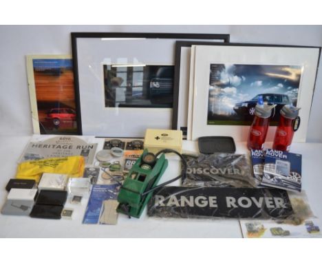 Collection of Land Rover and Range Rover ephemera to include key rings, playing cards, tyre inflator, prints etc. (largest 70