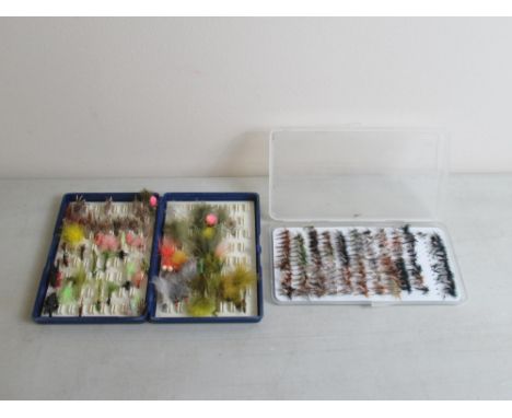 Four cases of hand-tied fly fishing lures of various styles and materials