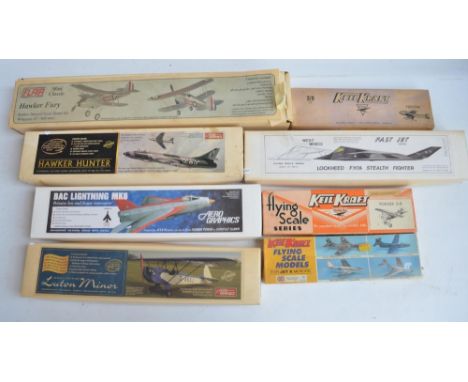 Eight unbuilt rubber band powered balsa wood model aircraft to include Flair Mini Classic Hawker Fury, West Wings Stealth Fig