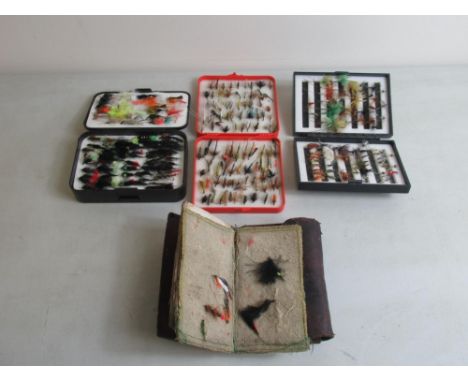 Three plastic cases and one leather wallet of hand-tied fly fishing lures of various styles and materials