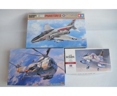 Three unstarted 1/48 US Navy themed model aircraft kits to include a Tamiya McDonnell Douglas F-4B Phantom II and Hasegawa Do