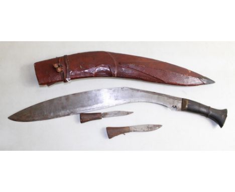 Large Burmese Kukri. In leather and wood sheath, wood handle, karda and chakmak. Blade length 45cm