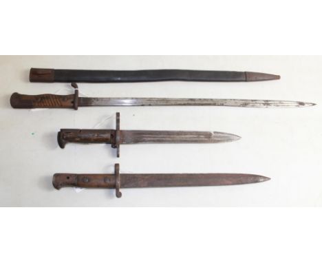 Extra long WWI German bayonet with scabbard. U.F.H. 1943 U.S. Bayonet/trench knife. British 1903 pattern trench knife