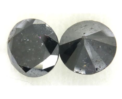 Two loose AIG certified black diamonds, each over 4cts. P&amp;P Group 1 (£14+VAT for the first lot and £1+VAT for subsequent 