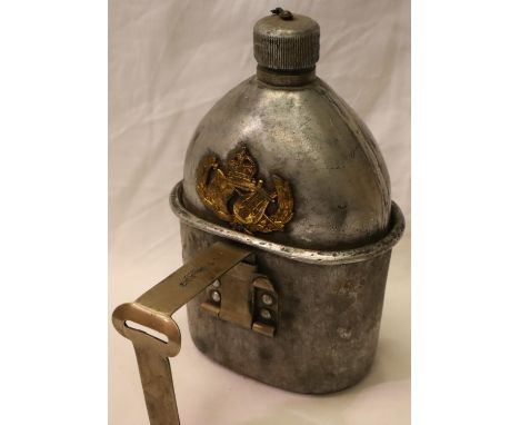 American WWI/WWII M1910 canteen with cup, mounted with an allied badge (unknown) semi relic condition. P&amp;P Group 2 (£18+V