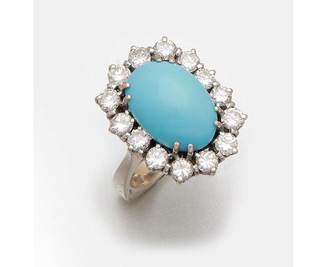 Weißgold, gest. 585. Zentral besetzt mit einem persischen Türkiscabochon, entouriert von Brillanten von zus. ca.  1,40 ct.; G