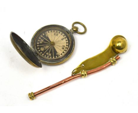 A copper and brass bosun's whistle and a brass-cased Singer's patent handheld compass (2).