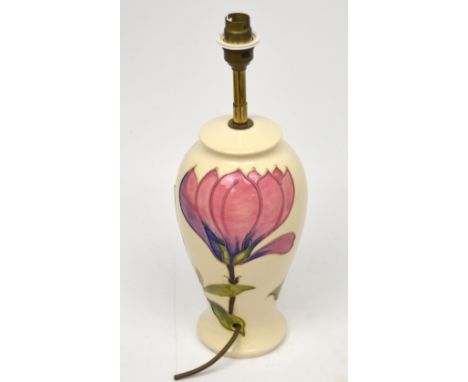 A Moorcroft 'Magnolia' pattern baluster table lamp, height 27cm.