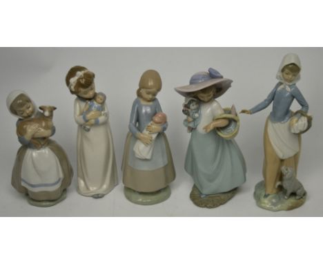 Three various Nao figures, a young girl carrying a lamb and two young girls carrying dolls and two further similar Spanish po