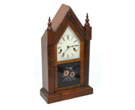 A late 19th century American walnut-cased lancet-shaped mantel clock, height 50cm.