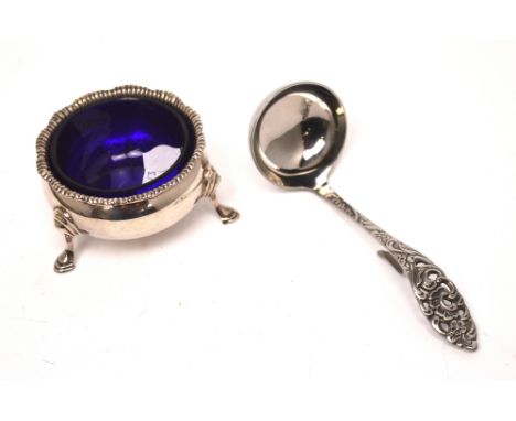 A George V hallmarked silver salt with blue liner, London 1929 and a boxed Sola-Nassief Dutch plated ladle (2).