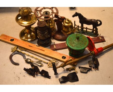 Two vintage metal door stops, a tilly lamp, a quantity of plated spoons, a spirit level, a portable stove, a brass pump and a