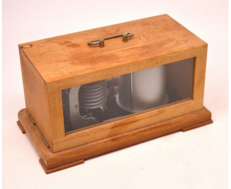 An 'Veb Feingerätebau 9362 Drebach/ERZG GDR' barograph, type 2051, in glazed wooden case with carrying handle, raised on brac