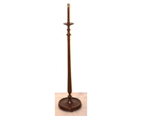An Edwardian mahogany turned standard lamp on circular base, height 160cm.