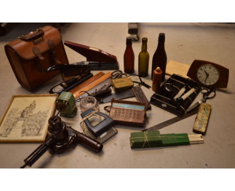 A box of collectibles to include rulers, set squares, vintage scissors, staplers, cased bowling balls, vintage bottles etc.