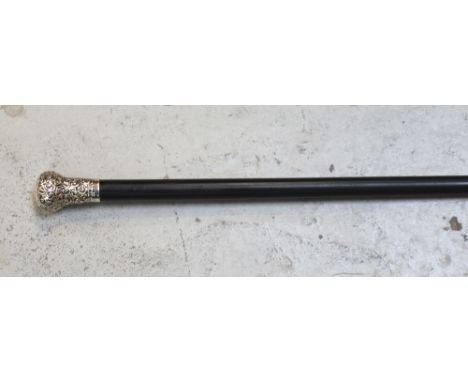 A Victorian ebonised walking stick with hallmarked silver handle.