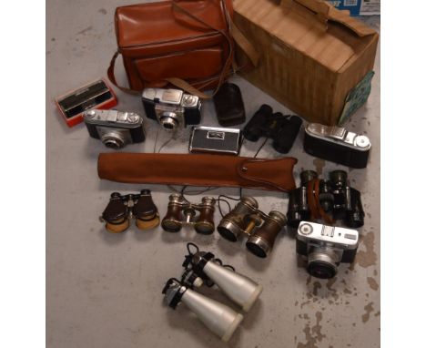 A quantity of vintage cameras and binoculars to include Kodak and Agfa.