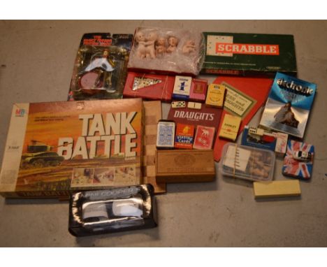 A small quantity of vintage toys and game boards to include Scrabble, vintage playing cards, dominoes and four Kewpie dolls.