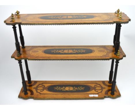 A gilt metal walnut and inlaid three-tier shelf for wall-mounting with turned ebonised supports, width 59cm.