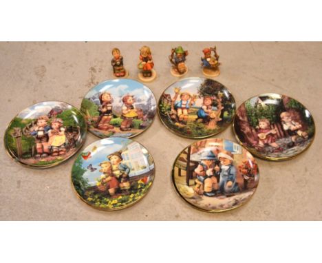 Two pairs of Goebel/Hummel figures, each pair with matching limited edition plate; 'Apple Tree Boy and Girl' and 'Little Expl