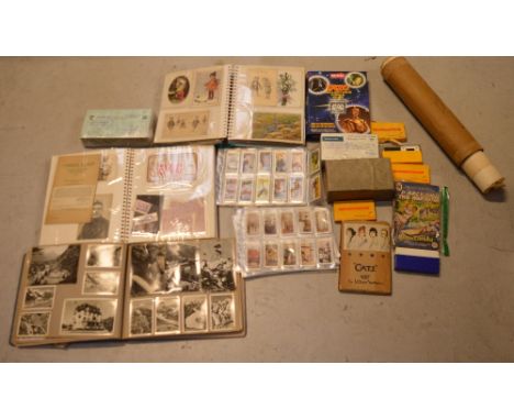 A quantity of vintage slides and a view finder, a scrapbook containing various pin badges and military buttons, a quantity of
