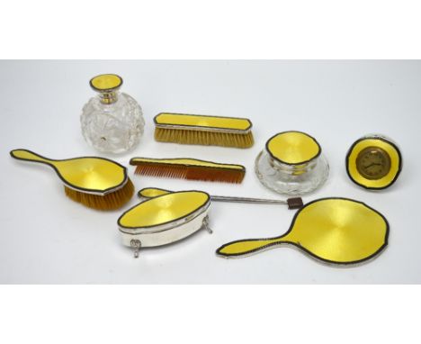 A comprehensive hallmarked silver and guilloché enamel mounted dressing table set comprising a cut glass scent bottle, a cut 